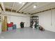 Unfinished basement with painted concrete floors, overhead lighting, and storage at 8324 Thorn Bend Dr, Indianapolis, IN 46278