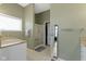 Bathroom featuring granite counters, framed mirror, and walk-in shower at 8324 Thorn Bend Dr, Indianapolis, IN 46278