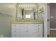 Bathroom vanity featuring granite counters and modern light fixtures at 8324 Thorn Bend Dr, Indianapolis, IN 46278