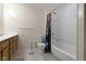 Cozy bathroom with tiled walls, shower, and vanity with drawers for storage at 8324 Thorn Bend Dr, Indianapolis, IN 46278