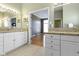 Bathroom with double vanities, granite counters, and access to the bedroom at 8324 Thorn Bend Dr, Indianapolis, IN 46278