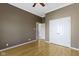 Bedroom with light hardwood floors, a ceiling fan, a closet, and neutral paint at 8324 Thorn Bend Dr, Indianapolis, IN 46278