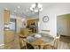 Bright breakfast nook featuring wood table and chairs with stainless steel appliances in the background at 8324 Thorn Bend Dr, Indianapolis, IN 46278