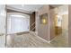 Spacious foyer with hardwood floors, a large front door, and access to other rooms at 8324 Thorn Bend Dr, Indianapolis, IN 46278