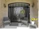 Inviting front entrance with a black double door, decorative wreath, and seating at 8324 Thorn Bend Dr, Indianapolis, IN 46278