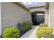Close-up of the home's entryway, featuring a black double door and manicured landscaping at 8324 Thorn Bend Dr, Indianapolis, IN 46278
