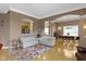 Open-concept living space featuring hardwood floors, cozy seating, and an open layout ideal for entertaining at 8324 Thorn Bend Dr, Indianapolis, IN 46278