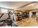 Finished basement featuring a Peloton bike, home office, and open layout at 8330 Dumfries Dr, Brownsburg, IN 46112
