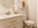 Cozy bathroom with a modern vanity, round mirror, and soft lighting at 8330 Dumfries Dr, Brownsburg, IN 46112