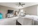 Spacious bedroom featuring neutral walls, carpet, a ceiling fan, and a home office space at 8330 Dumfries Dr, Brownsburg, IN 46112