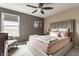 Serene bedroom featuring a plush bed, neutral walls, soft carpeting, and a bright window at 8330 Dumfries Dr, Brownsburg, IN 46112