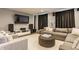 Cozy living room with a comfortable sectional sofa and large screen television at 8330 Dumfries Dr, Brownsburg, IN 46112