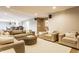 Bright living room with a view into the kitchen and comfortable seating at 8330 Dumfries Dr, Brownsburg, IN 46112