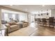 Bright living room featuring comfortable seating and breakfast bar access at 8330 Dumfries Dr, Brownsburg, IN 46112