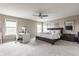 Spacious main bedroom with a desk area, windows, and neutral décor, creating a serene retreat at 8330 Dumfries Dr, Brownsburg, IN 46112