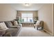 Inviting playroom featuring a comfortable sofa, ample storage, and natural light, creating a fun space at 8330 Dumfries Dr, Brownsburg, IN 46112