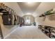 Expansive walk-in closet with comprehensive shelving, hanging racks, and a central seating area at 8330 Dumfries Dr, Brownsburg, IN 46112