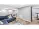 Finished basement with a large couch, area rug, table, and exercise equipment at 8639 Lancaster Rd, Indianapolis, IN 46260