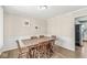 Classic dining room with a large wooden table, six chairs, and traditional wainscoting at 8639 Lancaster Rd, Indianapolis, IN 46260