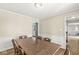 Inviting dining room featuring a hardwood table, six chairs, and a view into the kitchen at 8639 Lancaster Rd, Indianapolis, IN 46260