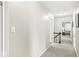 Upstairs hallway with carpet and doors leading to various rooms at 8639 Lancaster Rd, Indianapolis, IN 46260