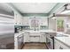 Bright kitchen features white cabinets, stainless steel appliances, and a farmhouse sink at 8639 Lancaster Rd, Indianapolis, IN 46260
