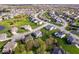 Extensive aerial shot of a residential development with vibrant lawns, verdant trees, and diverse architectural styles at 957 Commander Ct, Westfield, IN 46074