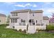 Spacious backyard showcases a deck, lush lawn, and well-maintained landscaping at 957 Commander Ct, Westfield, IN 46074