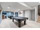 Spacious basement with a pool table, shuffleboard and ample room for entertaining at 957 Commander Ct, Westfield, IN 46074