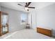 Bright bedroom with a chest of drawers, display cabinet, and natural light from the large window at 957 Commander Ct, Westfield, IN 46074