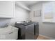 Convenient laundry room features modern washer and dryer set, plus utility sink and storage at 957 Commander Ct, Westfield, IN 46074
