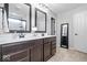 Contemporary main bathroom with double vanity, modern fixtures, and a large framed mirror at 957 Commander Ct, Westfield, IN 46074