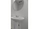 Close-up of a pedestal sink and round mirror in the bathroom at 10138 Redwood Peak Ln, Indianapolis, IN 46259
