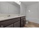 This bathroom has double sinks, dark cabinets, and modern fixtures at 10138 Redwood Peak Ln, Indianapolis, IN 46259