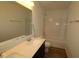 Bathroom featuring a double sink vanity, large mirror, and bathtub shower at 10138 Redwood Peak Ln, Indianapolis, IN 46259