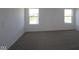Bright bedroom with two windows and neutral carpet at 10138 Redwood Peak Ln, Indianapolis, IN 46259