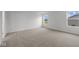 A light-filled bedroom shows neutral carpet with natural light from two windows at 10138 Redwood Peak Ln, Indianapolis, IN 46259