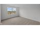Bedroom displaying neutral carpet and a window with a neighborhood view at 10138 Redwood Peak Ln, Indianapolis, IN 46259