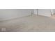 Large bedroom featuring neutral carpeting and multiple doorways at 10138 Redwood Peak Ln, Indianapolis, IN 46259