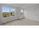 Bright bedroom with neutral carpet, white walls, and large windows for ample natural light at 10138 Redwood Peak Ln, Indianapolis, IN 46259