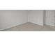 A bright bedroom displays a closet and additional doorway and neutral carpet at 10138 Redwood Peak Ln, Indianapolis, IN 46259
