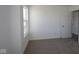 Bedroom with carpet, a window, and a closet door at 10138 Redwood Peak Ln, Indianapolis, IN 46259