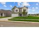 Charming two-story home featuring a well-manicured lawn and a two-car garage on a sunny day at 10138 Redwood Peak Ln, Indianapolis, IN 46259