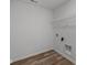 This laundry room features wood-look floors and a wire storage shelf at 10138 Redwood Peak Ln, Indianapolis, IN 46259