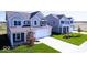 Beautiful two-story homes with well-manicured lawns and driveways, showcasing suburban living at 10138 Redwood Peak Ln, Indianapolis, IN 46259