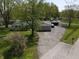 Aerial view of the home highlighting the driveway, garage, and surrounding mature trees at 1029 Price Rd, Avon, IN 46123