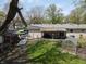 Aerial view of a large backyard featuring a greenhouse, hammock, shed, and garden at 1029 Price Rd, Avon, IN 46123