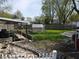 Large backyard featuring a green house, hammock, and garden at 1029 Price Rd, Avon, IN 46123