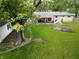 Backyard featuring patio area, greenhouse, manicured lawn at 1029 Price Rd, Avon, IN 46123