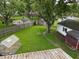 Backyard aerial shows detached garage, greenhouse, shade tree, and well maintained lawn at 1029 Price Rd, Avon, IN 46123
